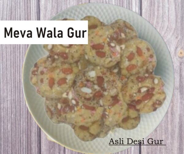 Meva Wala Gur in a rustic bowl, showcasing golden jaggery with almonds, pistachios, and cashews, a natural sweetener for health and flavor.